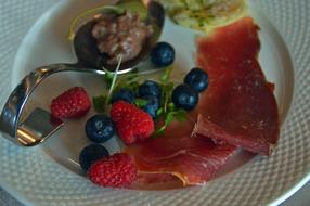 Meat and fruit on a plate