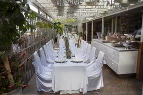 white chairs with a decorated table