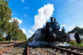 Steam black smoke train on a trip