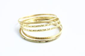 gold bracelet on a white background