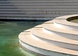 Beautiful stairs, among the colorful water of different shades
