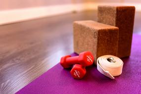 yoga bricks and dumbbells in the gym