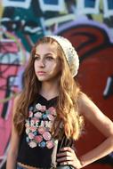 cool Teenager at wall with graffiti