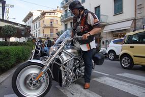 a man with a motorcycle gun on the street