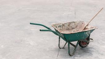 green wheelbarrow for construction work