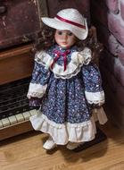vintage doll stands by retro radio