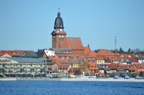 Beautiful city with a lot of red roofs on the coast