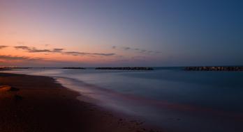 scenery of the purple sunset over beach