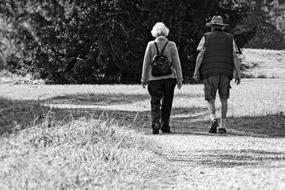 elderly couple on a walk in black and white background