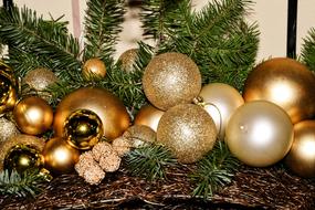 gold balloons with a green plant on the mantel.