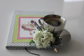 color notebook with coffee mug