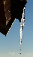 icicles on the roof of the house