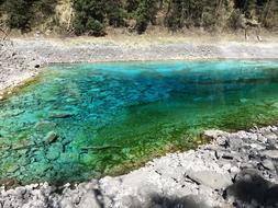 green pond in the mountains