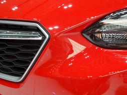 red in front of the subaru