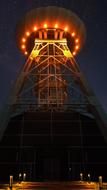 a tower with light in the night