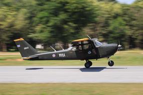 plane on the road on a green background