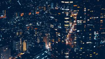 night photo of glass skyscrapers