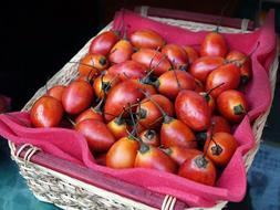 red exotic fruits in a box