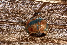 Close-up of the colorful and beautiful, oriental ceiling lamp on the ceiling