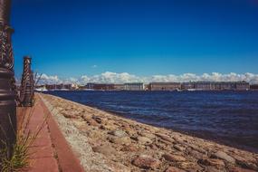 river on the beach near the city landscape