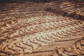 traces of large wheels on clay