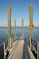 no fishing from floating dock sign on pier over water, usa, florida