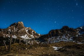 mountains with snow and trees in the evening landscape