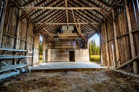 photo of the interior of an old wooden barn