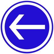 blue sign with a white arrow by the road