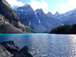 mountainous area with a lake on a blue background