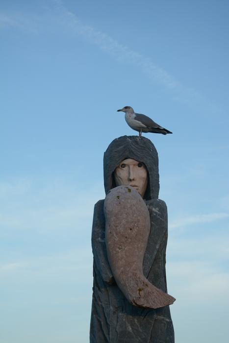 seagull on an old sculpture