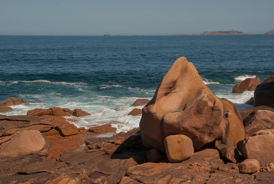 large rocks on the beach by the sea