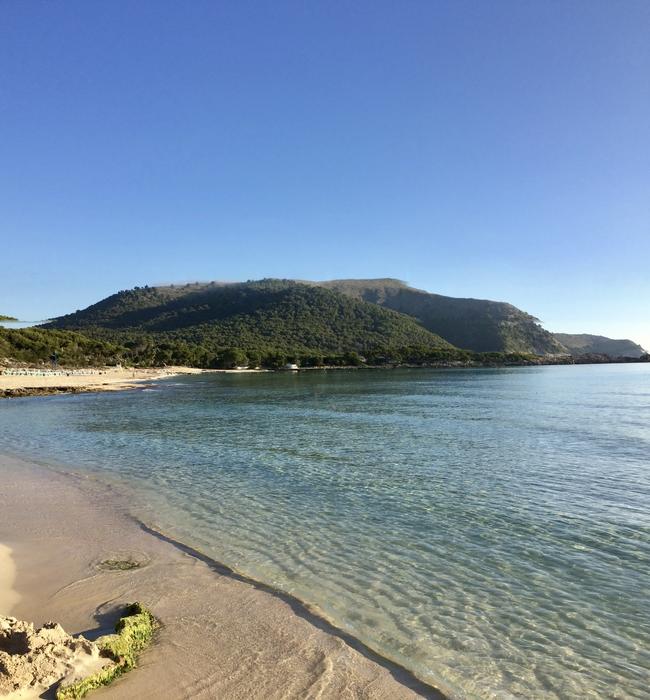sea with mountains beac