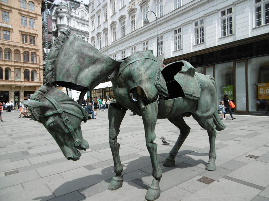 an unusual sculpture of a horse on the square