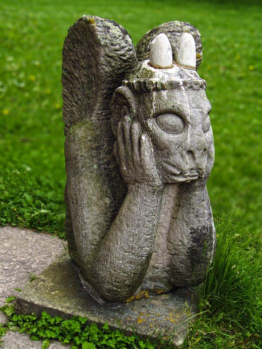gargoyle in a green meadow