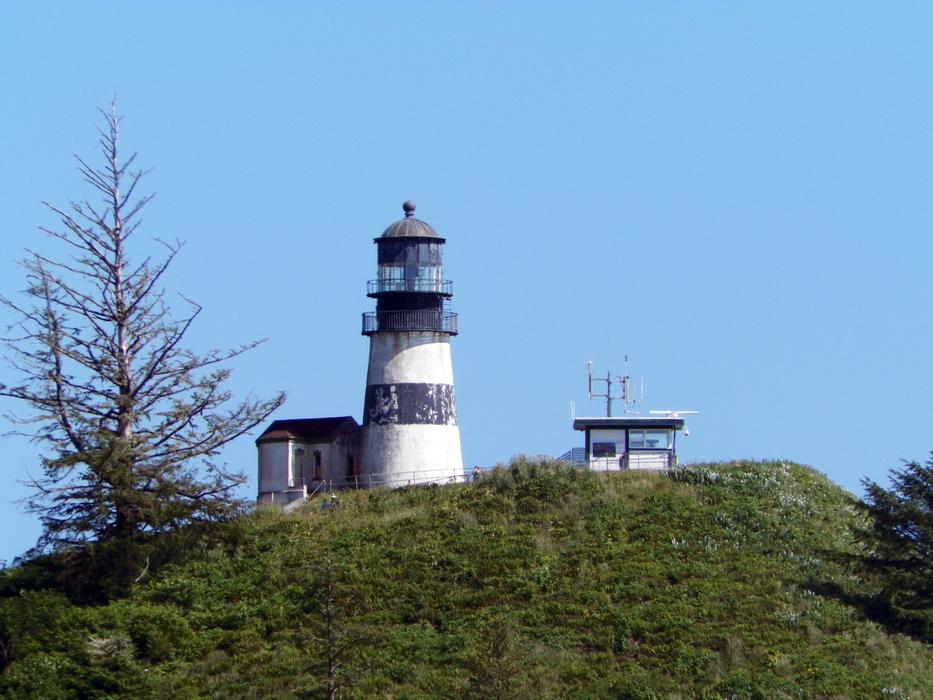 A shining lighthouse during the day