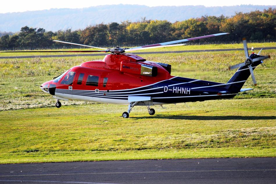 helicopter on a green meadow landscape