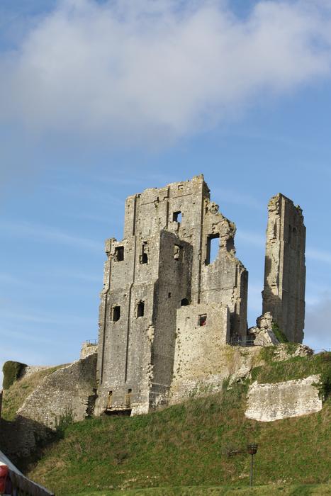 stone castle against a sky of clouds