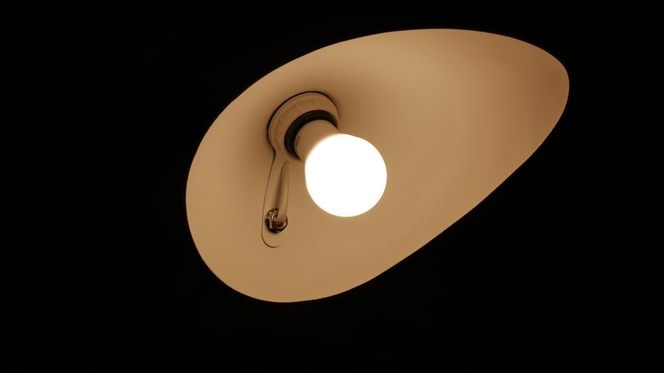 a lamp burning in the dark