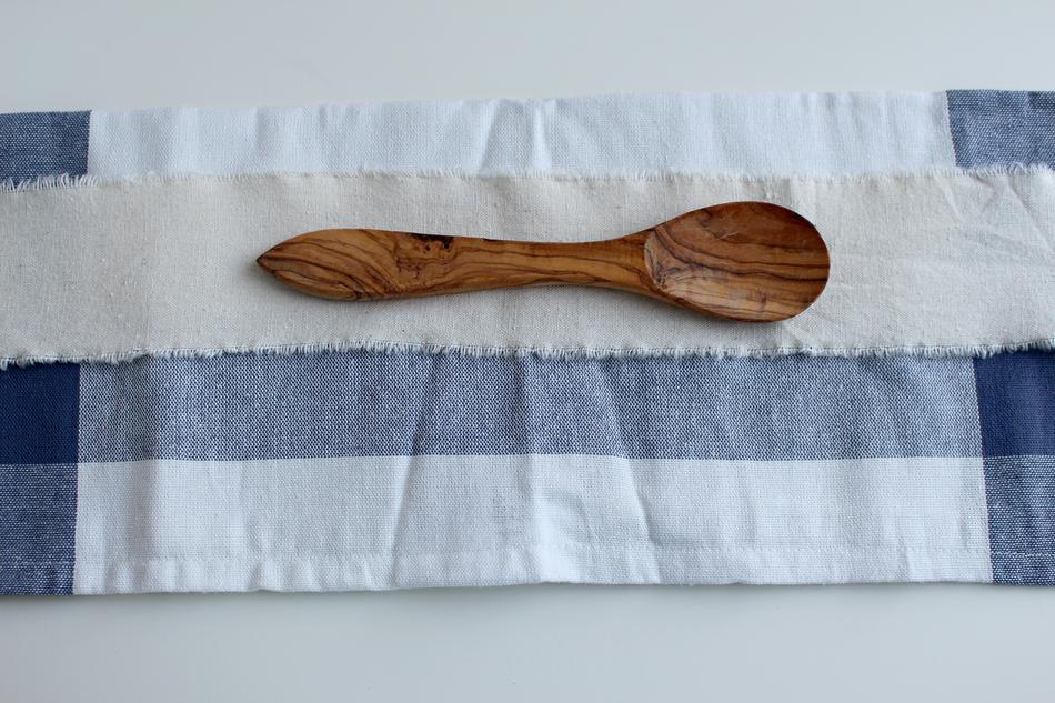 wooden spoon on a colored table