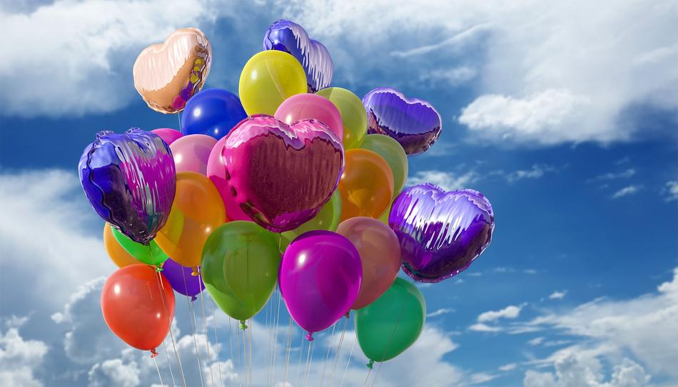 beautiful balloons on a blue background with clouds.