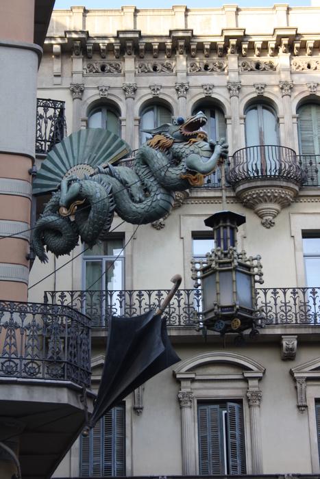 Beautiful and colorful dragon on the Casa Bruno Cuadros in Barcelona, Spain