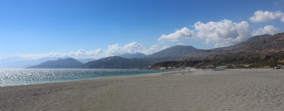 panorama of the sea beach in the mountains with clouds