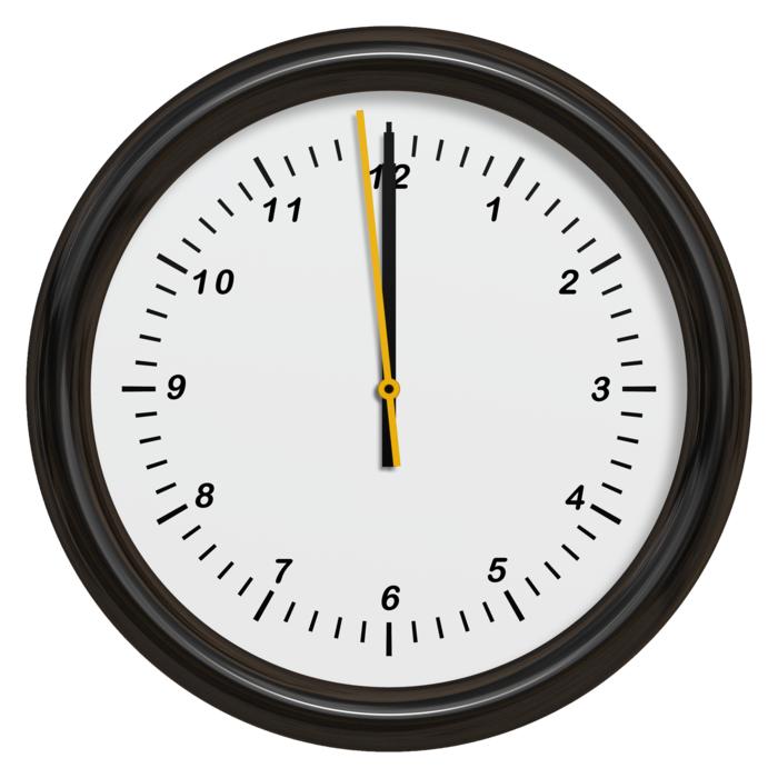 a clock in a black frame on the wall