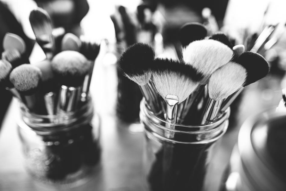 makeup brushes in a glass