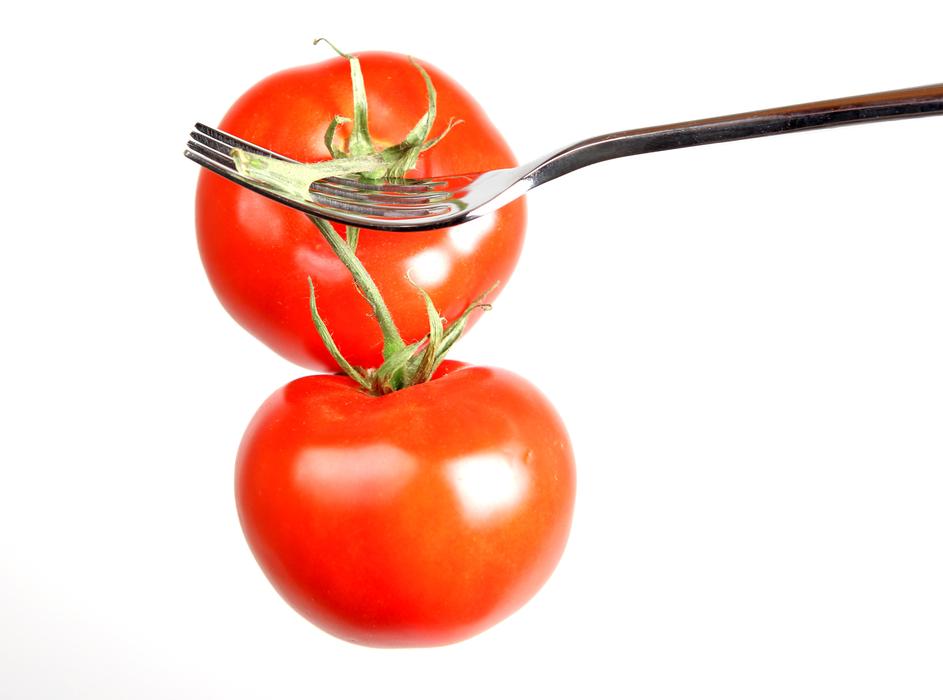 delicious ripe tomatoes in the vegetable garden