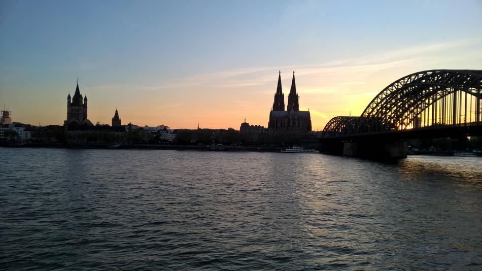 the silhouette of the bridge with the sea