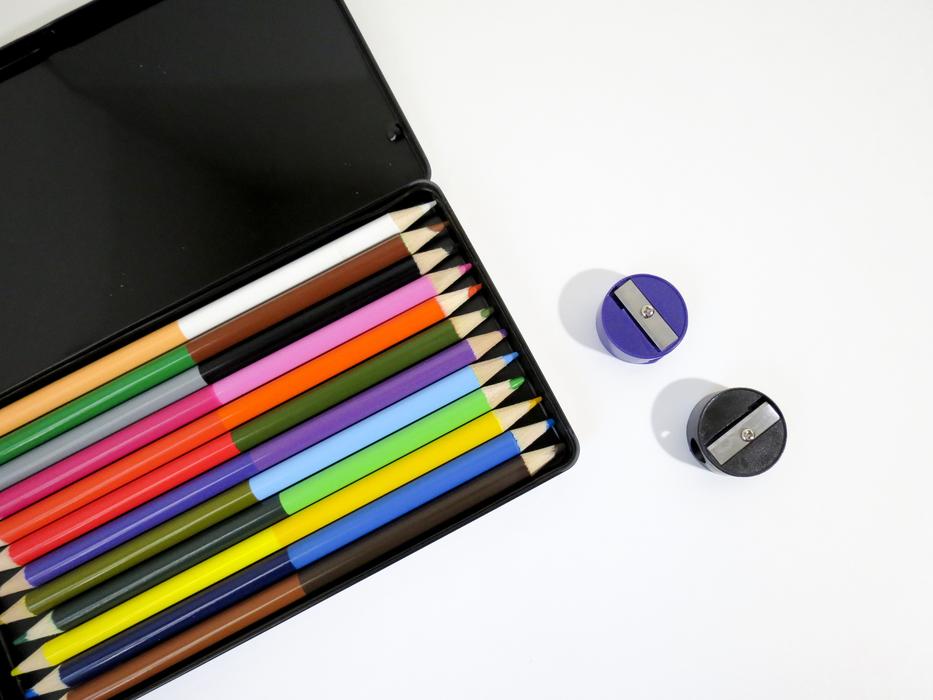 colored pencils in a pennant on a white background