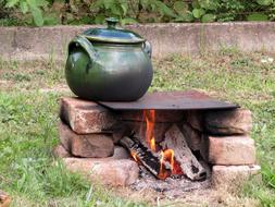 green pitcher on the fire