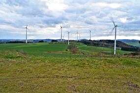windmills in the field against the sky